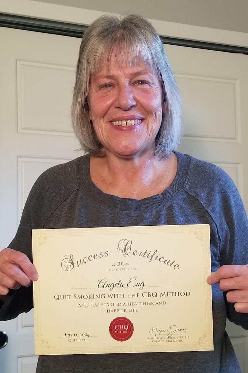 CBQ Nicotine Freedom Program member Angela Eng holding her CBQ Success Certificate