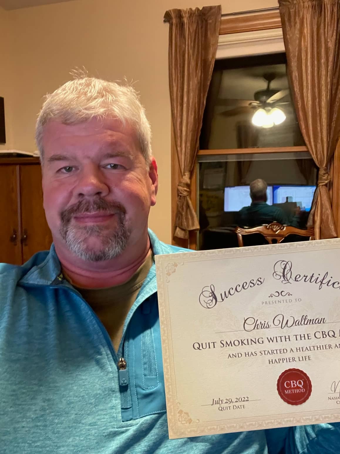 CBQ Nicotine Freedom Program member Chris Waltman holding his CBQ success certificate