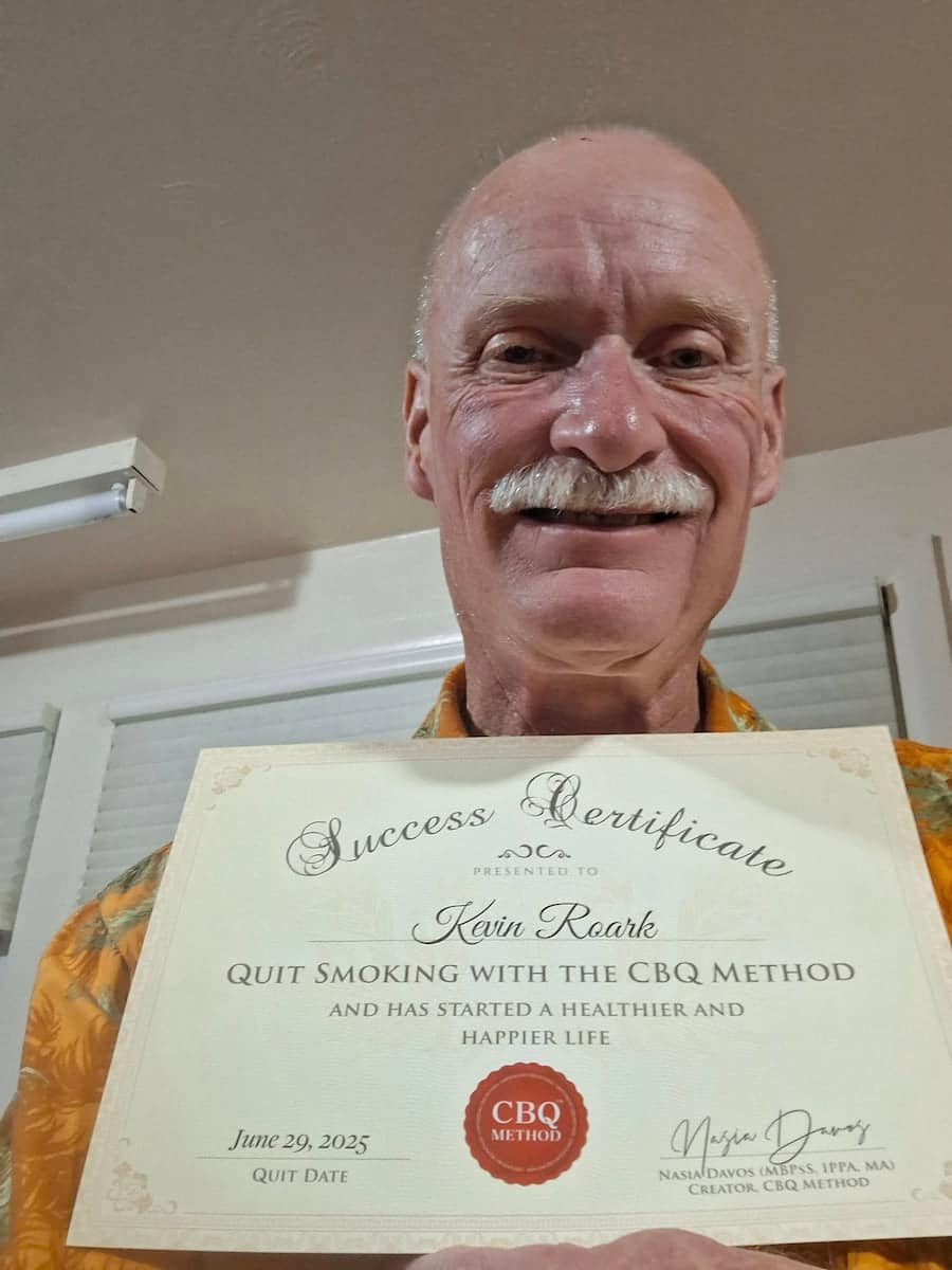 CBQ Nicotine Freedom program member Kevin Roark holding his CBQ Success Certificate