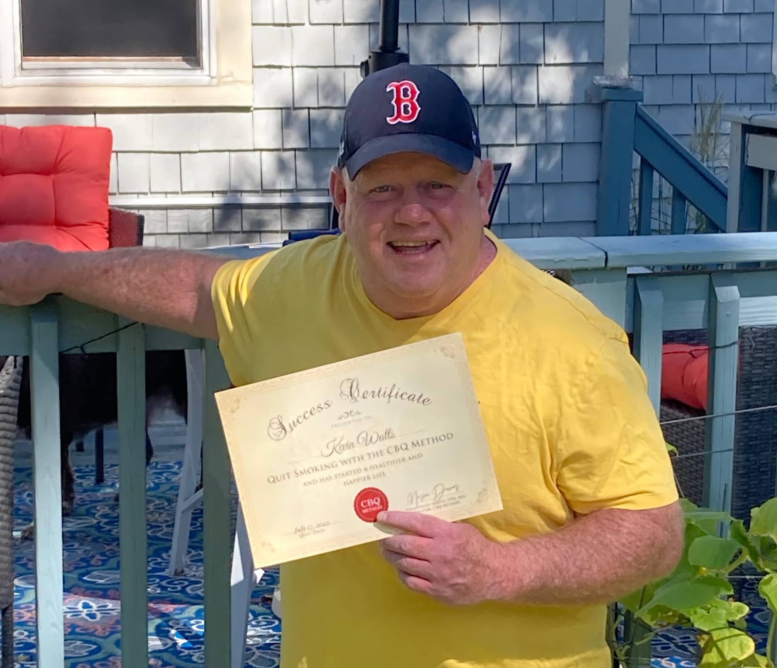 CBQ Nicotine Freedom Program member Kevin Watts holding his CBQ Success Certificate