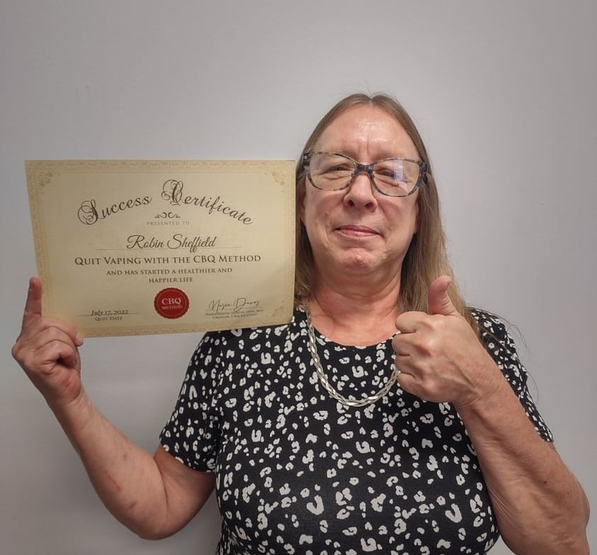 CBQ Nicotine Freedom Program member Robin Sheffield holding her CBQ Success Certificate