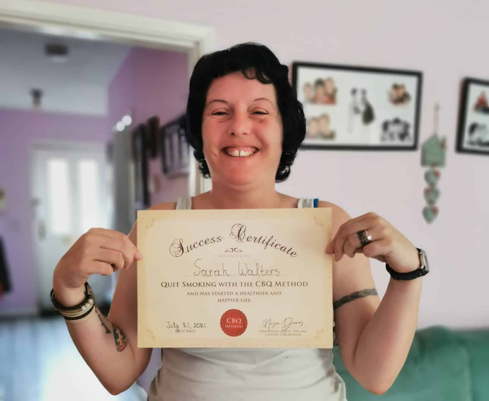 CBQ Nicotine Freedom Program member Sarah Walters holding her CBQ Success Certificate