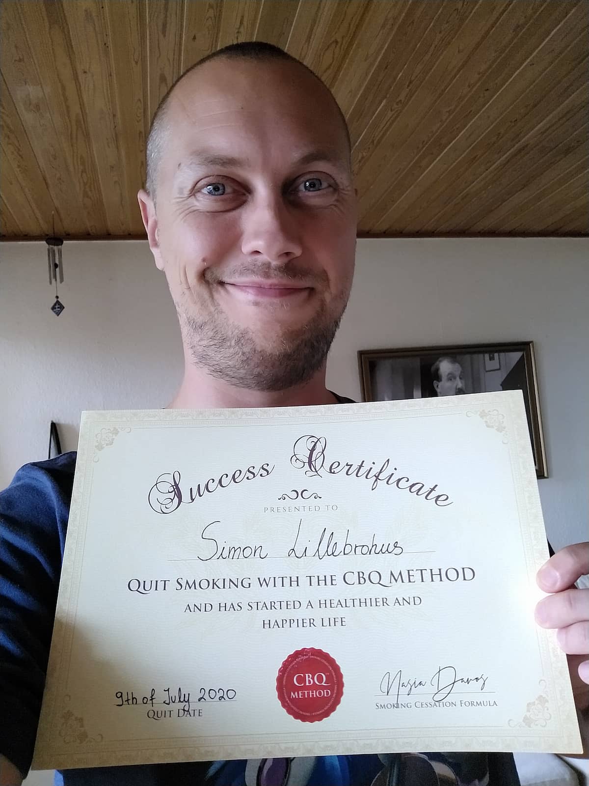 CBQ Nicotine Freedom Program member Simon Lillebrohus holding his CBQ Success Certificate