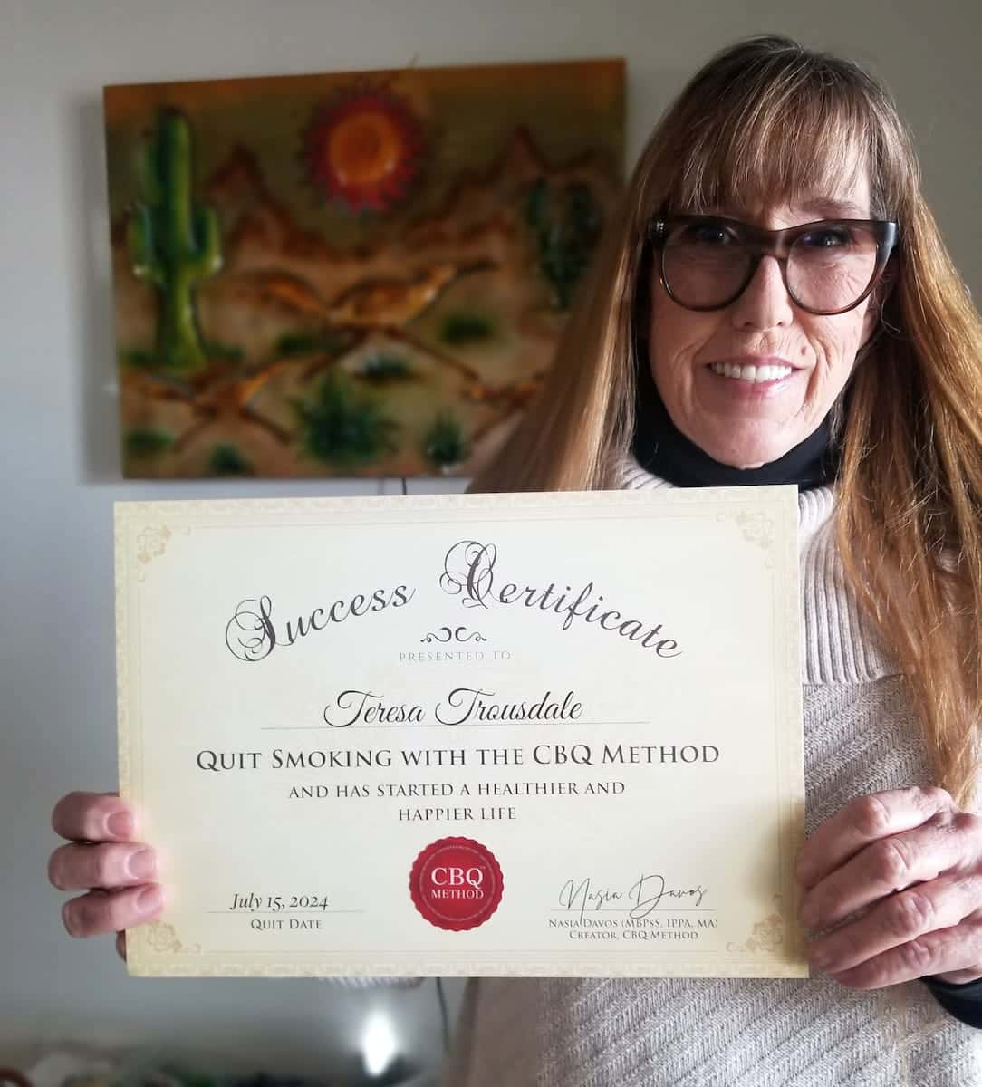 CBQ Nicotine Freedom Program member Teresa Trousdale holding her CBQ Success Certificate