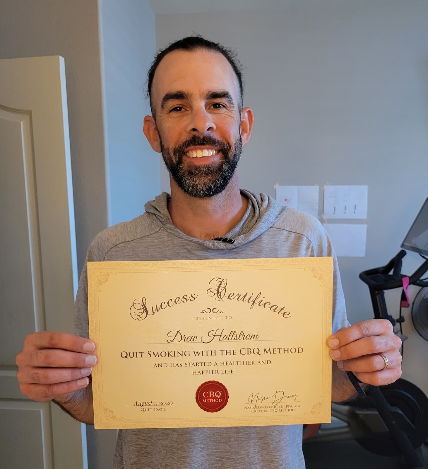 CBQ Nicotine Freedom Program Drew Hallstrom holding his CBQ Success Certificate