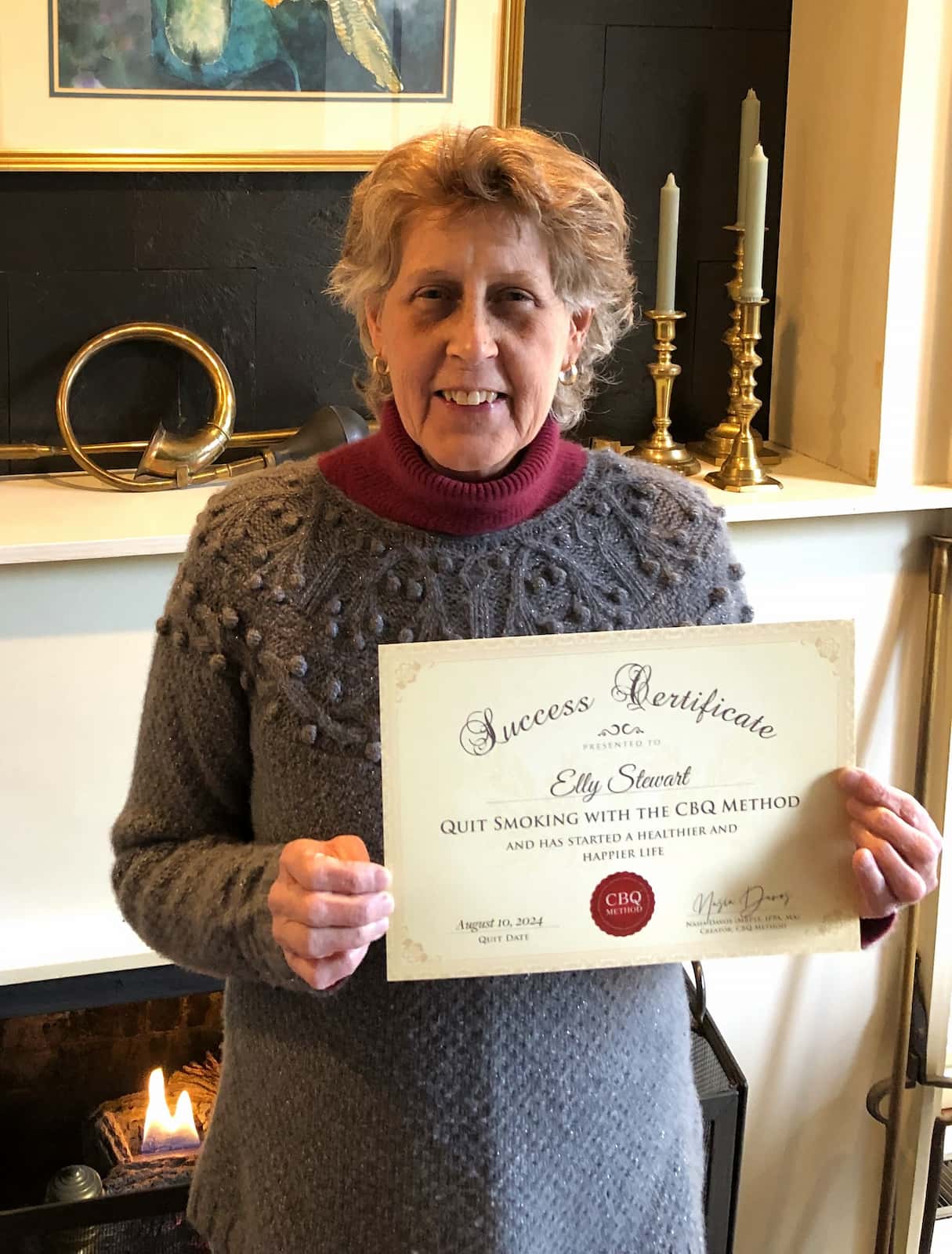CBQ Nicotine Freedom Program member Elly Stewart holding her CBQ Success Certificate