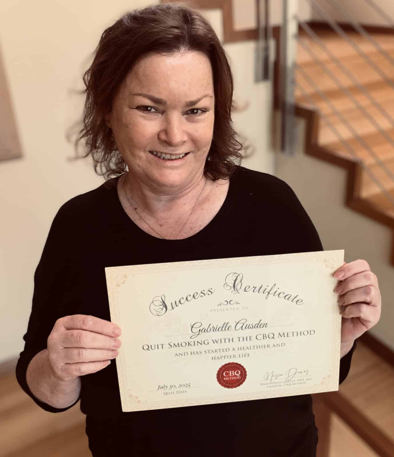 CBQ Nicotine Freedom Program Gabrielle Ausden holding her CBQ Success Certificate