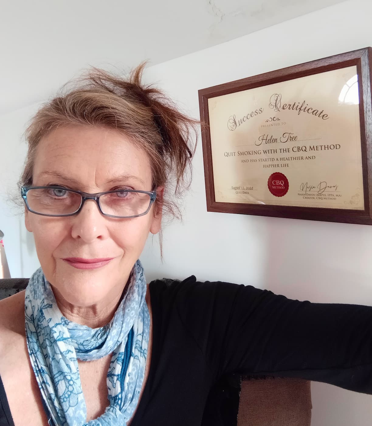 CBQ Nicotine Freedom Program member Helen Tree holding her CBQ Success Certificate