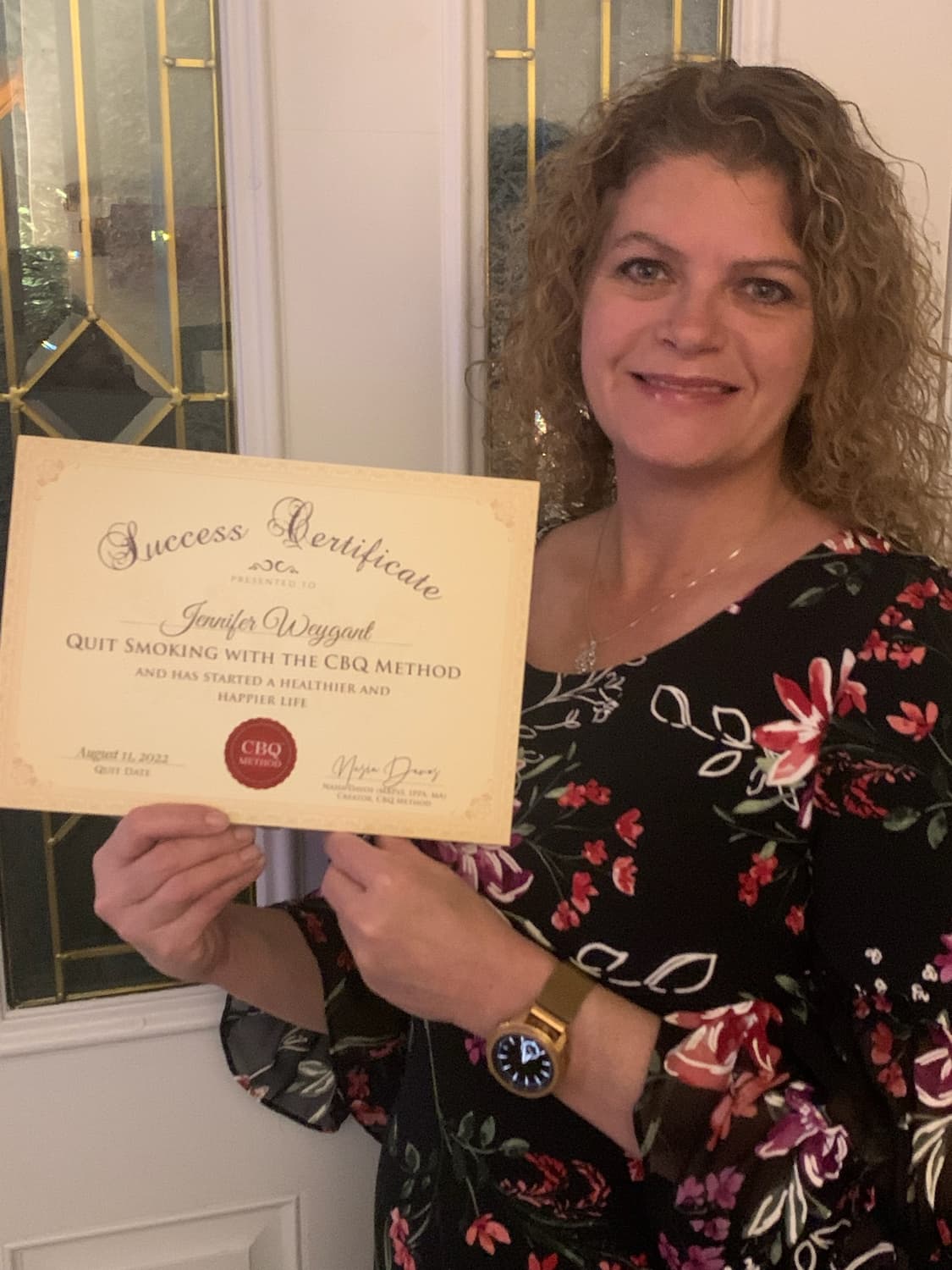CBQ Nicotine Freedom Program member Jennifer Weygant holding her CBQ Success Certificate