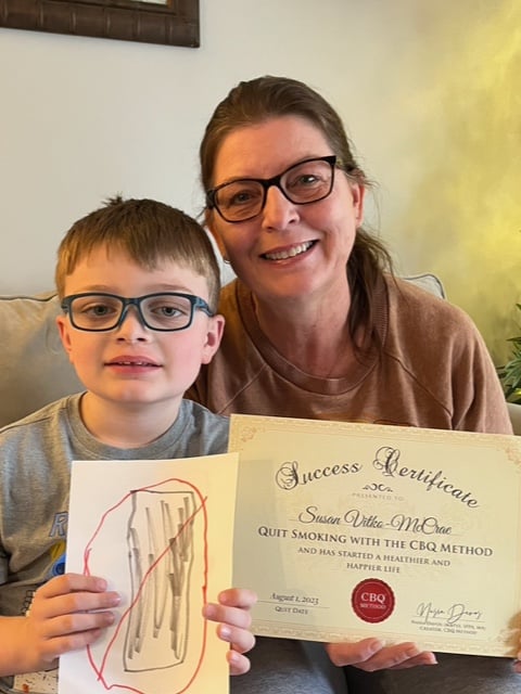 CBQ Nicotine Freedom Program Susan Vitko-McCrae holding her CBQ Success Certificate