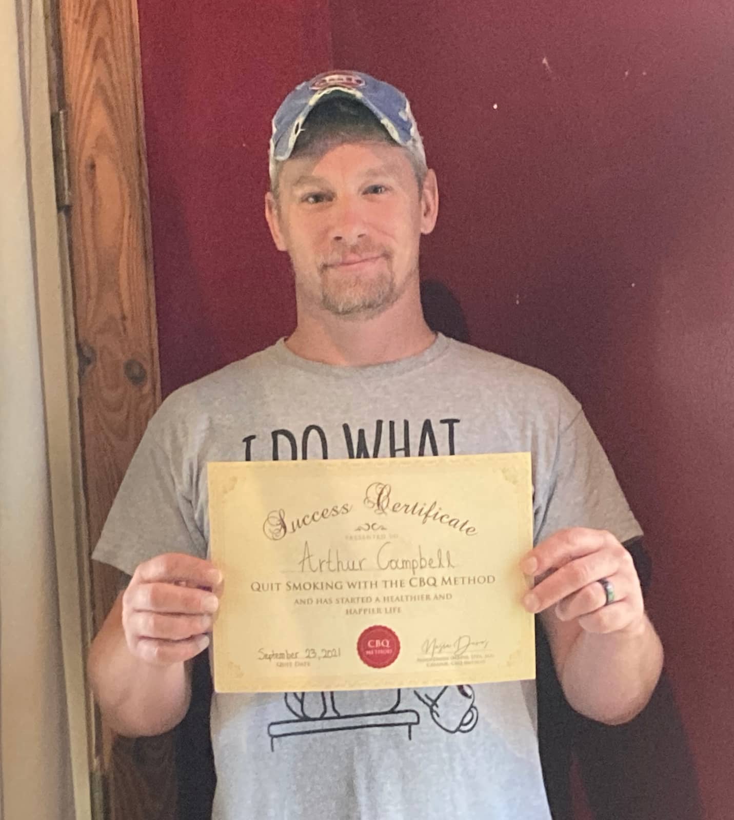 CBQ Nicotine Freedom Program member Arthur Campbell holding his CBQ Freedom Certificate