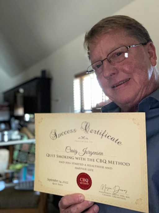 CBQ Nicotine Freedom Program member Craig Jorgensen holding his CBQ Freedom Certificate
