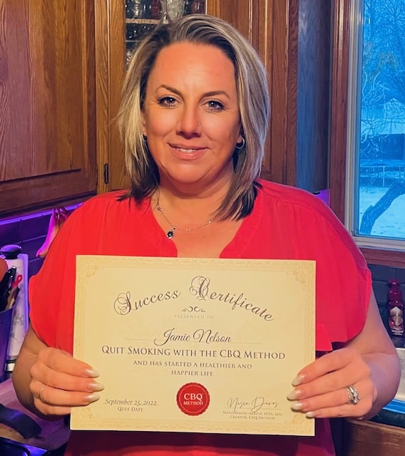CBQ Nicotine Freedom Program member Jamie Nelson holding her CBQ Freedom Certificate