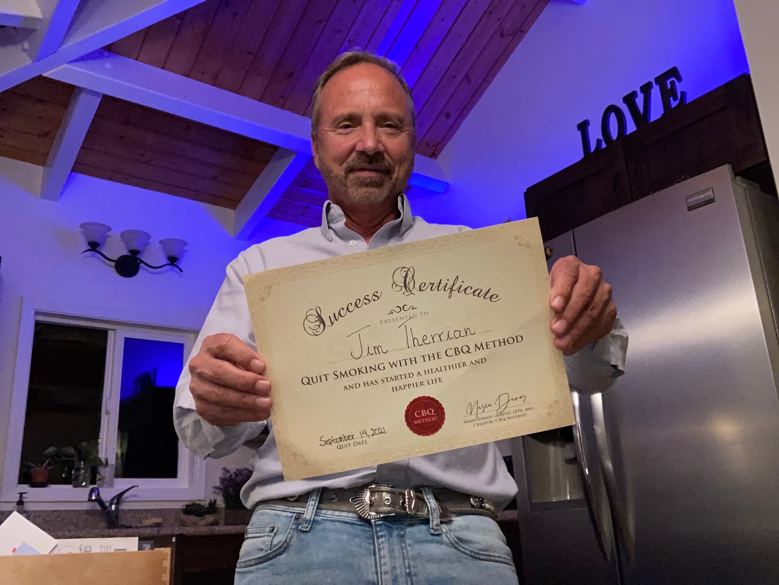 CBQ Nicotine Freedom Program member Jim Therrian holding his CBQ Freedom Certificate