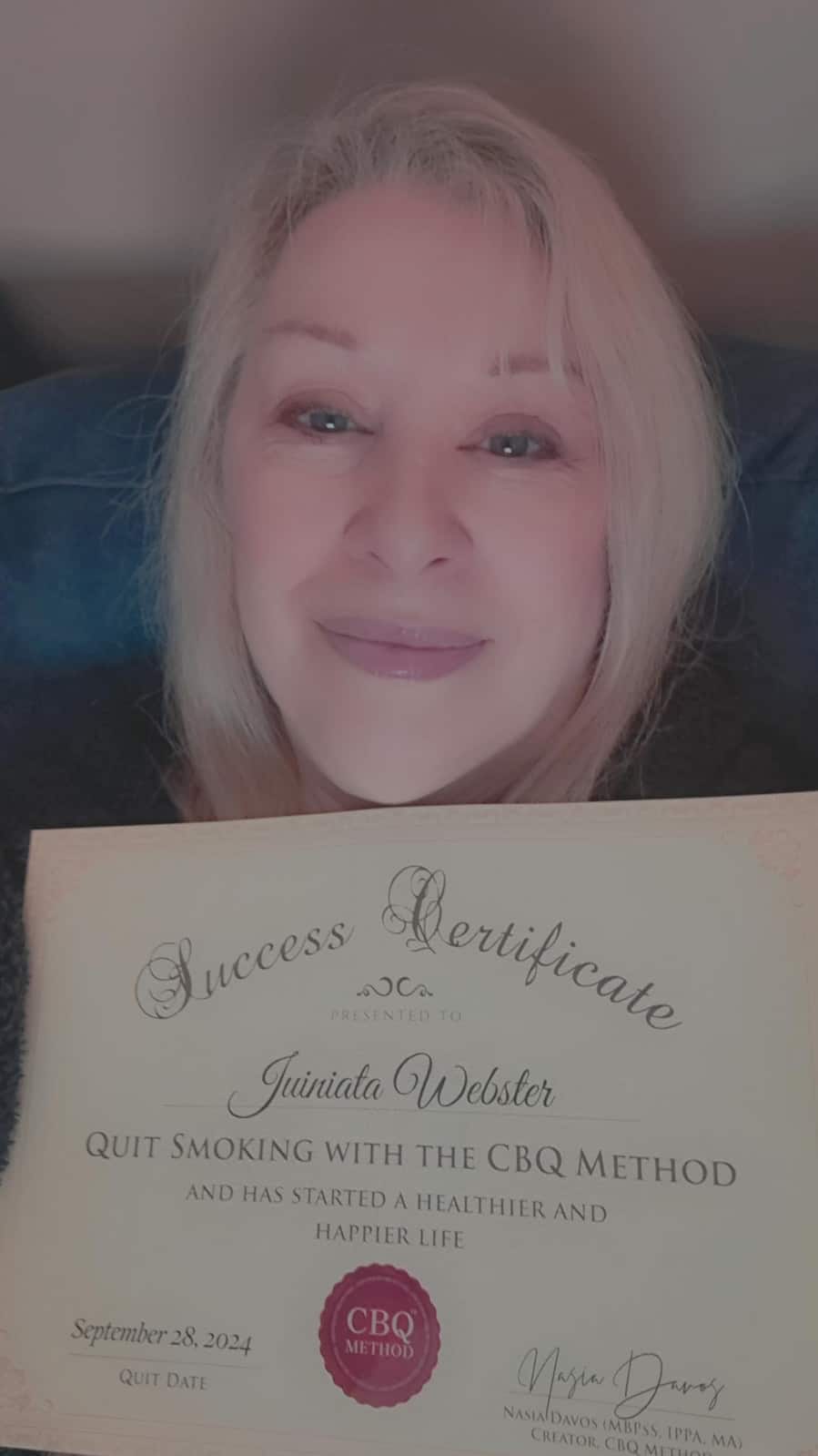 CBQ Nicotine Freedom Program member Juiniata Webster holding her CBQ Freedom Certificate