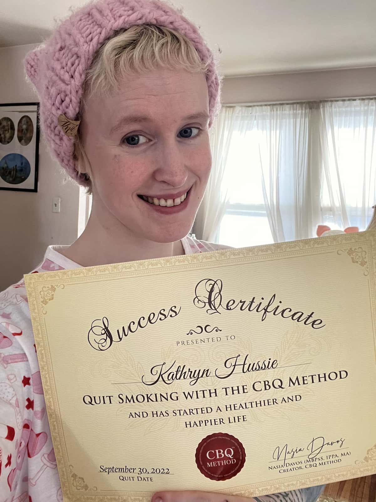 CBQ Nicotine Freedom Program member Kathryn Hussie holding her CBQ Freedom Certificate