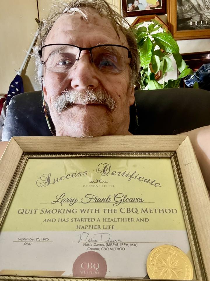 CBQ Nicotine Freedom Program member Larry Gleaves holding his CBQ Freedom Certificate