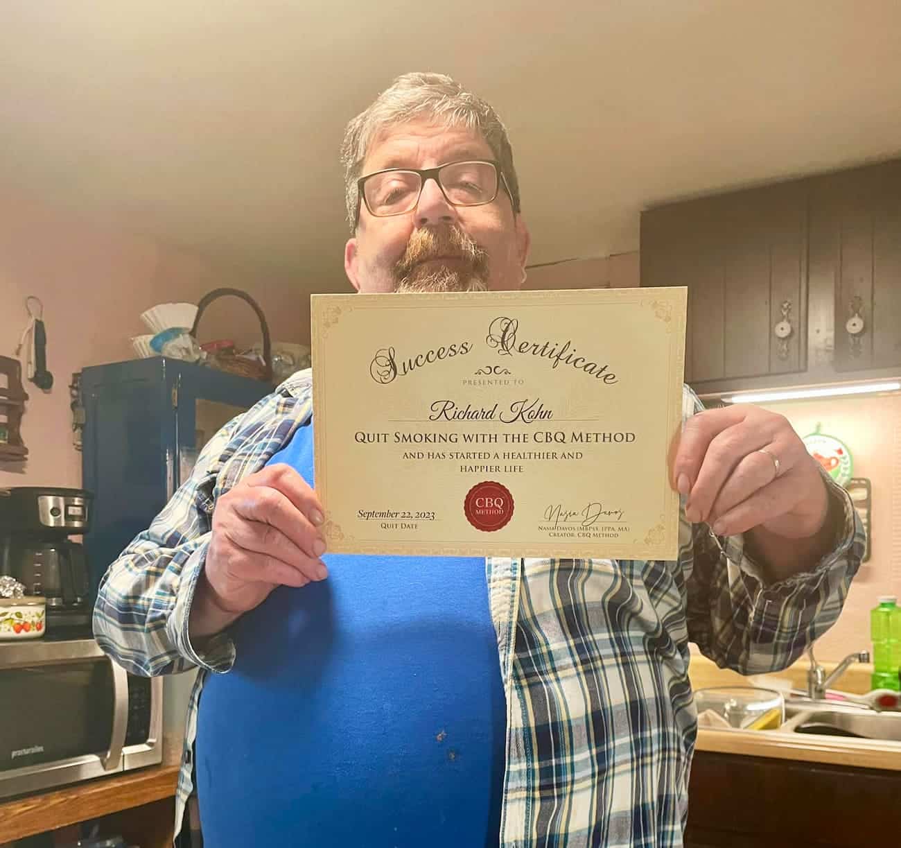 CBQ Nicotine Freedom Program member Rick Kohn holding his CBQ Freedom Certificate