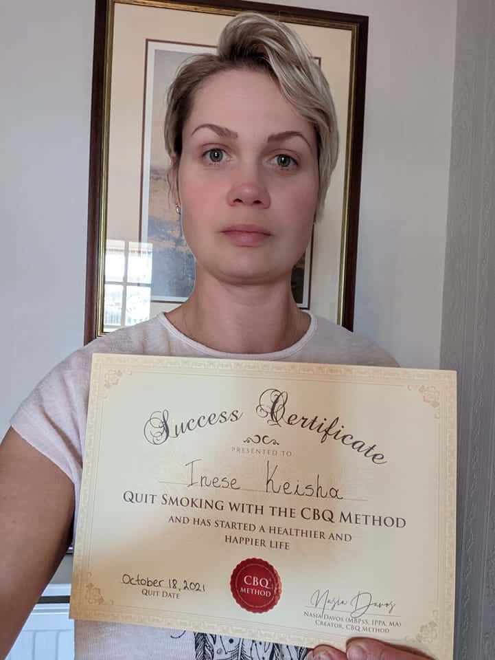 CBQ Nicotine Freedom Program member Inese Keisha holding her CBQ Freedom Certificate