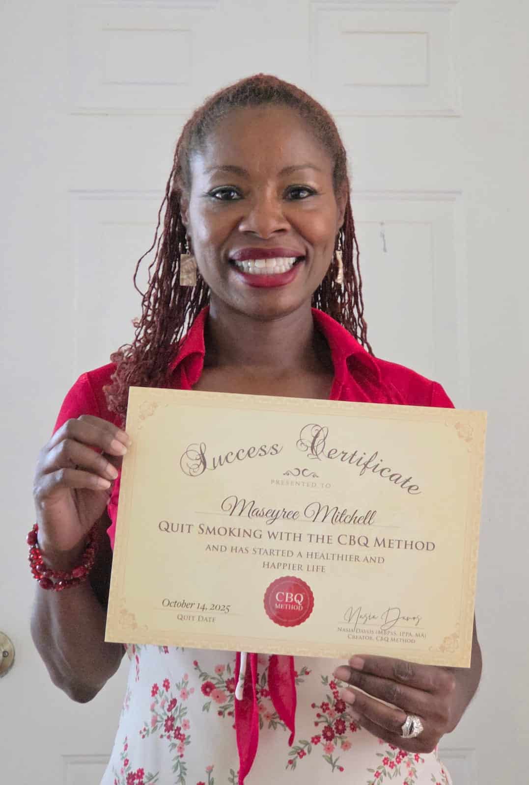 CBQ Nicotine Freedom Program member Maseyree Mitchell holding her CBQ Freedom Certificate