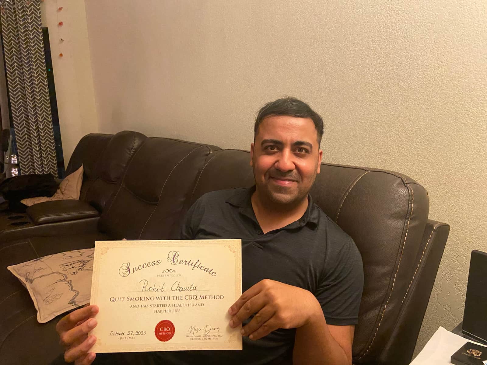 CBQ Nicotine Freedom Program Member Rohit Chawla holding his CBQ Freedom Certificate