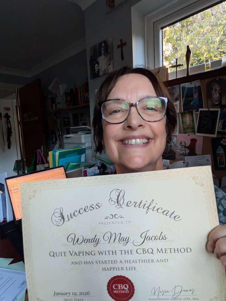 CBQ Nicotine Freedom Program member Wendy May Jacobs holding her CBQ Freedom Certificate
